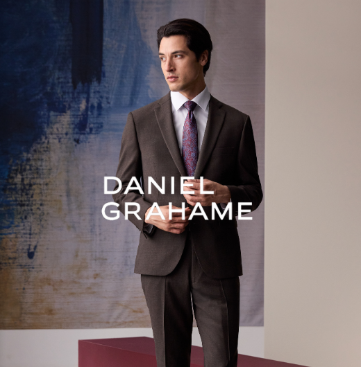 Man in brown suit and purple tie